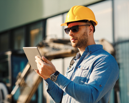 Construction engineer using digital tablet on the construction site