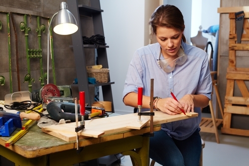 Carpenter marking a length of wood.